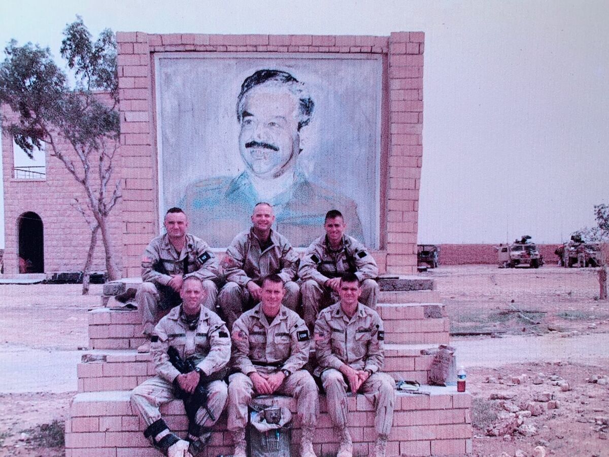 Charles Hartford (top center) poses with members of the Joint Special Operations Task Force that raided Saddam Hospital in Iraq.