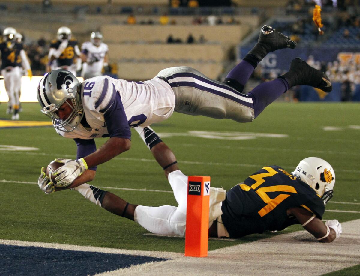 Kansas State wide receiver Tyler Lockett dives for the pylon as a flag is thrown for offensive pass interference during the Wildcats' 26-20 win over the West Virginia Mountaineers.