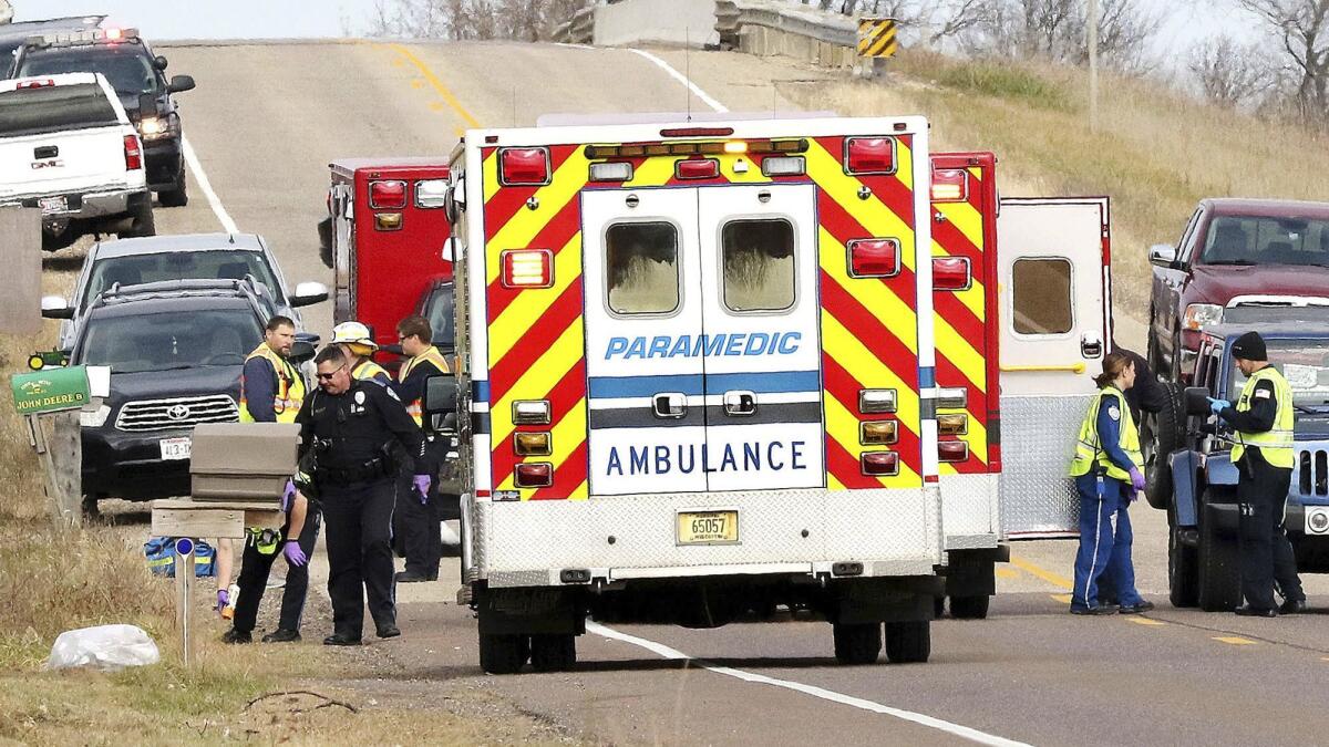 Emergency medical personnel gather Nov. 3 at the scene of a hit-and-run crash in Lake Hallie, Wis.