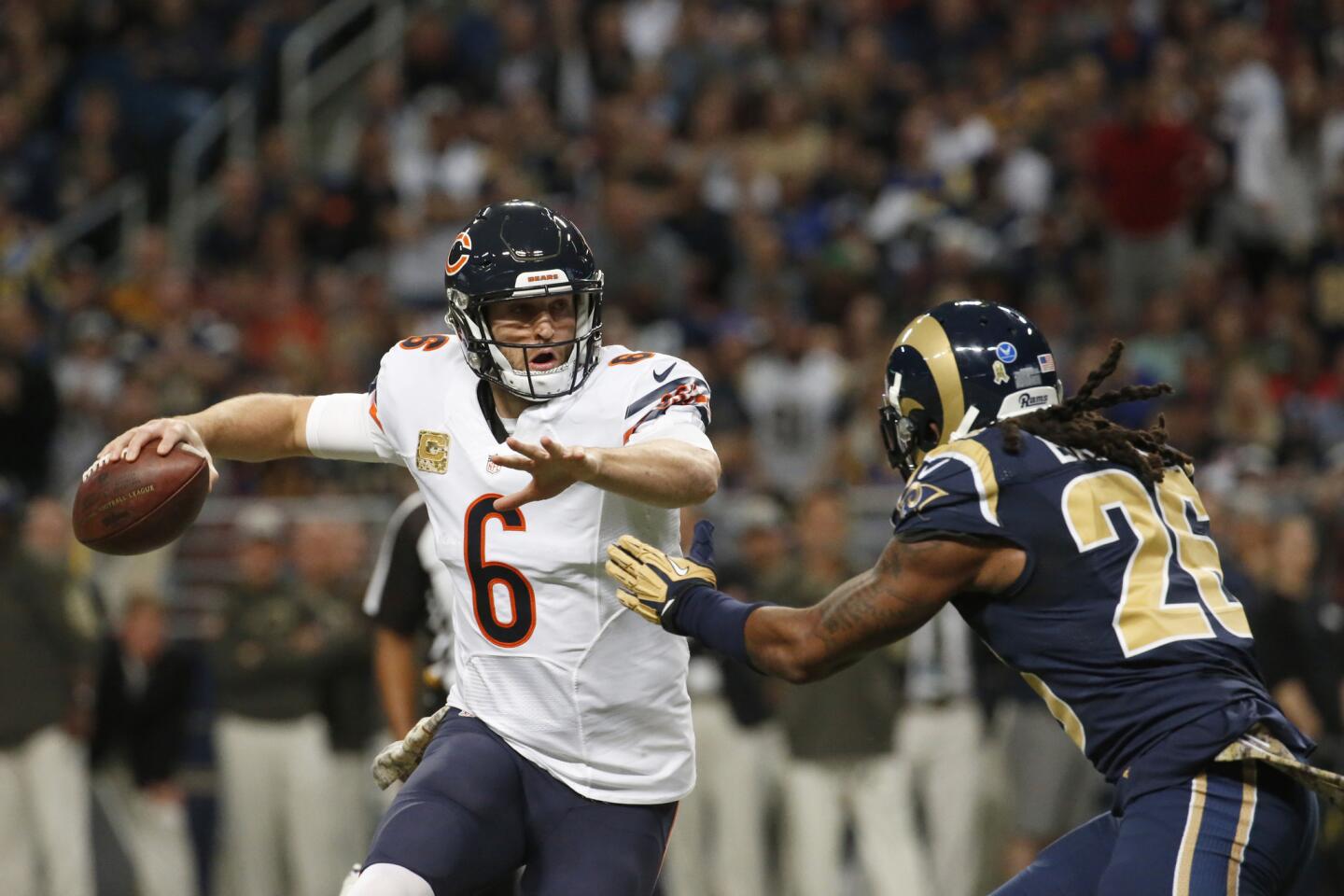 Jay Cutler looks to throw as the Rams' Mark Barron applies the pressure in the second quarter.