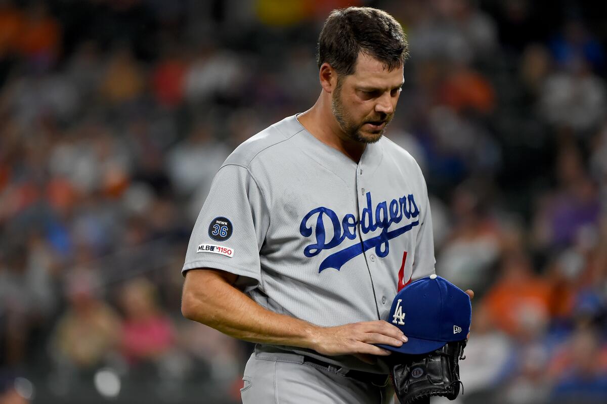 Dodgers pitcher Rich Hill leaves in the first inning against the Orioles on Sept. 12, 2019.