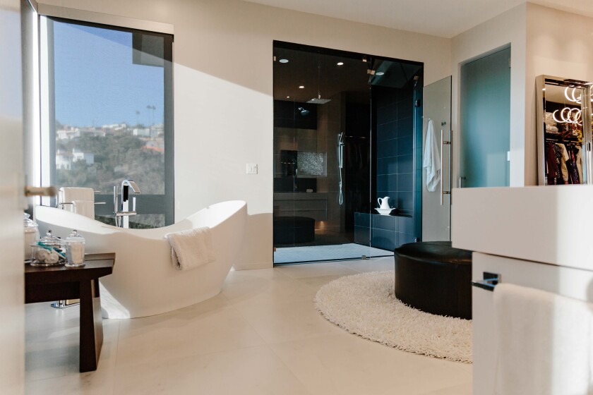 Raj Swenson created a spacious master bathroom in the La Jolla home, with sleek, modern fixtures and finishes.