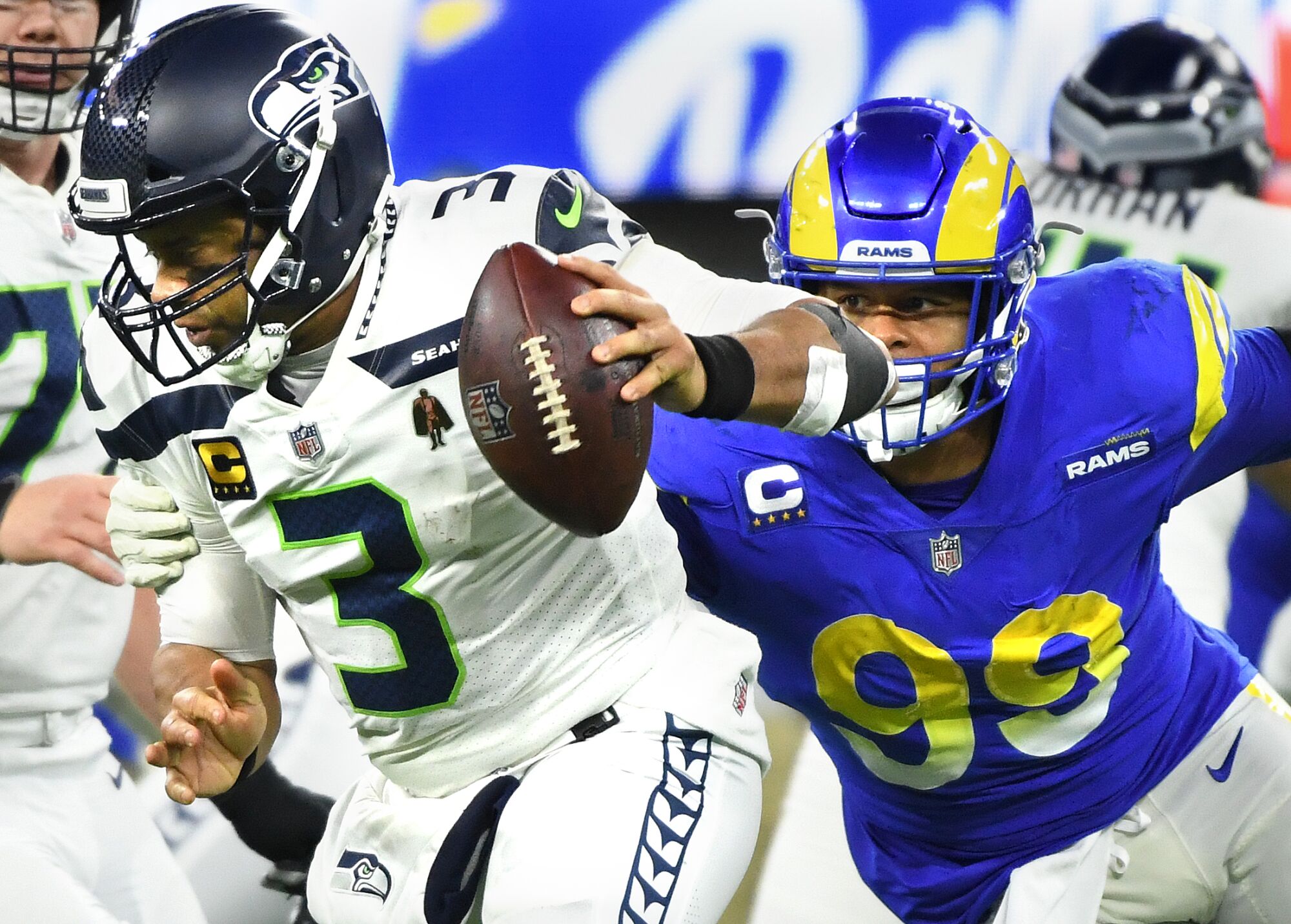 Rams defensive end Aaron Donald sacks Seahawks quarterback Russell Wilson.
