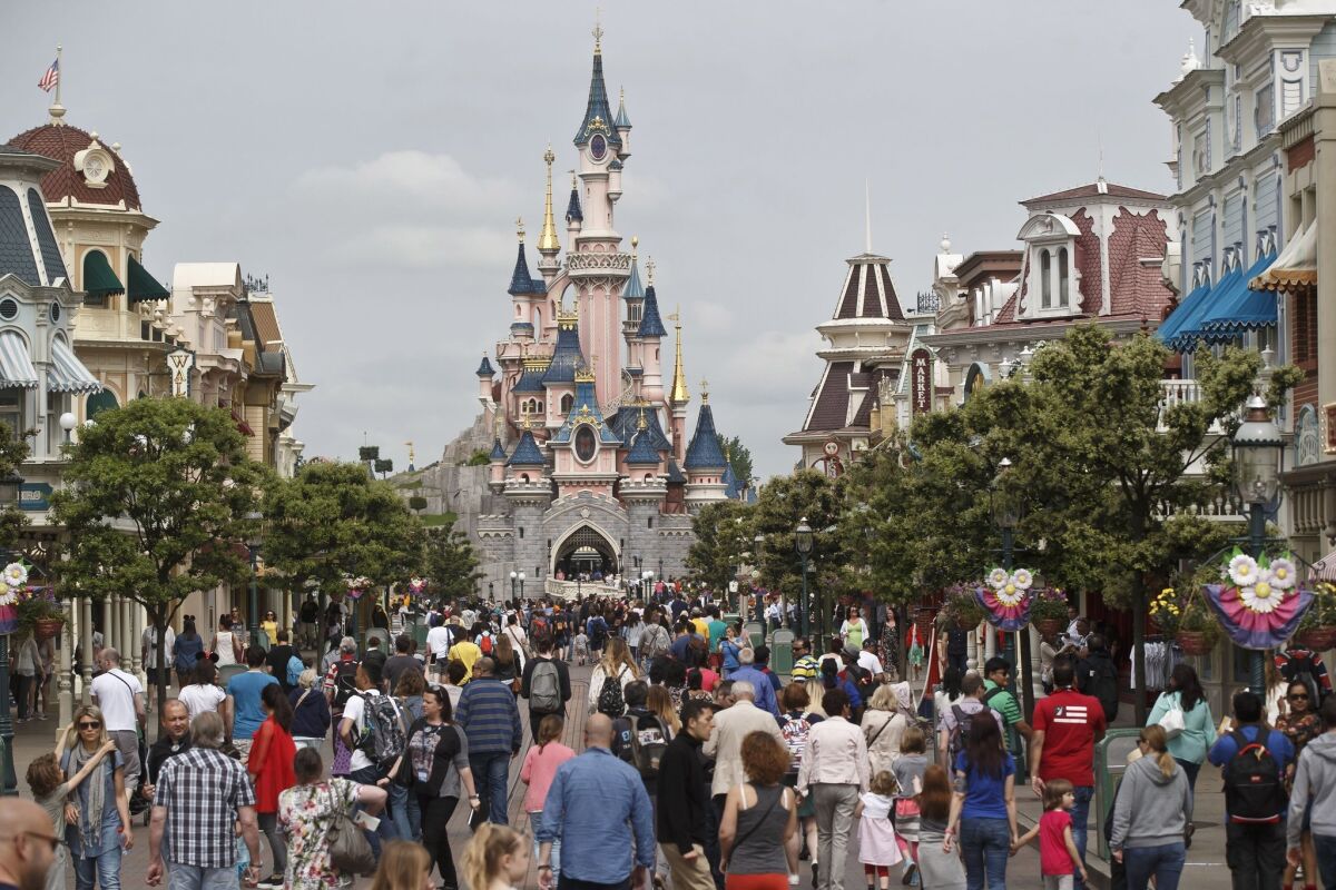 Disneyland Paris, shown in pre-pandemic times, is about 26 miles east of the French capital.