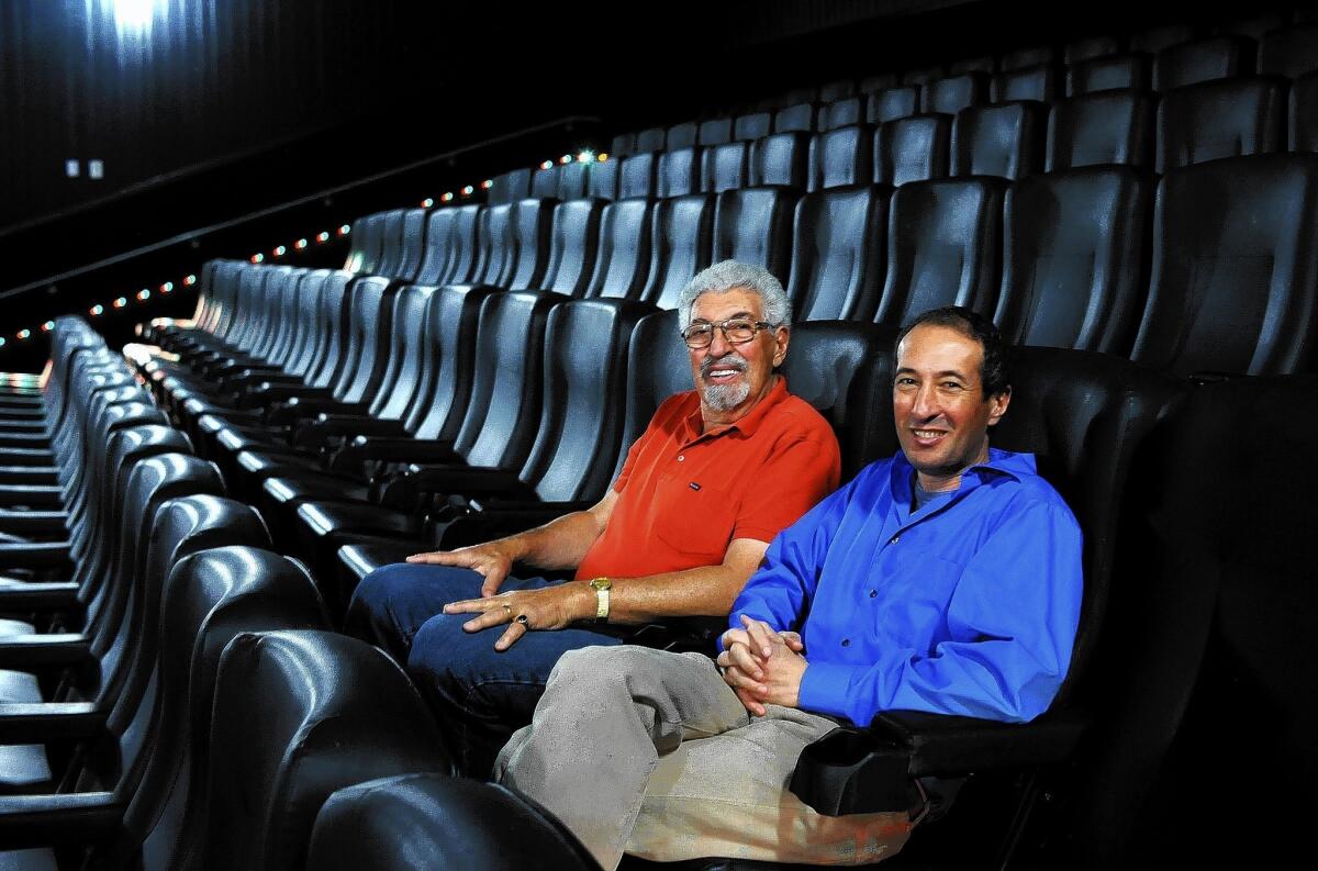 Robert Laemmle and his son Greg sit at the Laemmle Royal Theatre in West Los Angeles. “If you look at the track record of family businesses that have made it, to have survived this many generations is quite a remarkable achievement,” Greg Laemmle said.