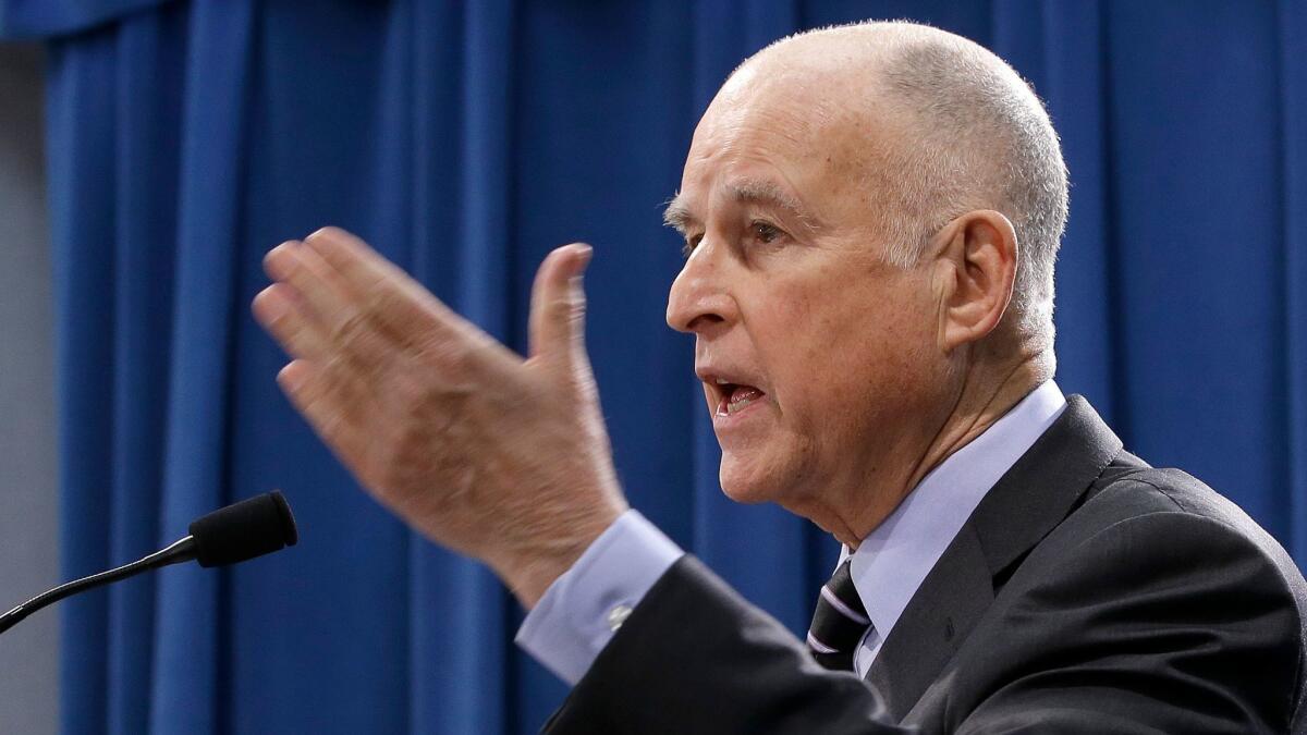 California Gov. Jerry Brown responds to question concerning his revised $124 billion state budget plan on May 11 in Sacramento.