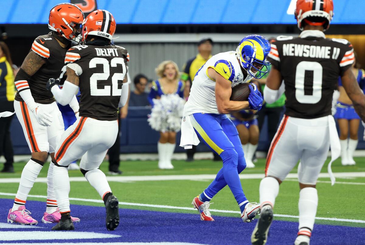 The Rams' Cooper Krupp catches a touchdown pass in front of the Browns' defense in the third quarter.