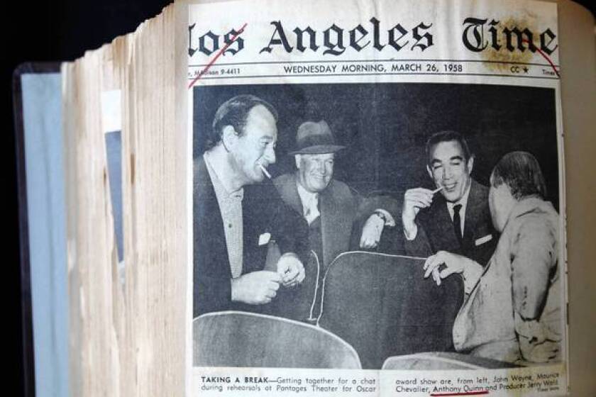 The front page of the Los Angeles Times from March 26, 1958, has a photo of John Wayne and Anthony Quinn; it is part of Quinn's personal archives at the Anthony Quinn Public Library in East Los Angeles.