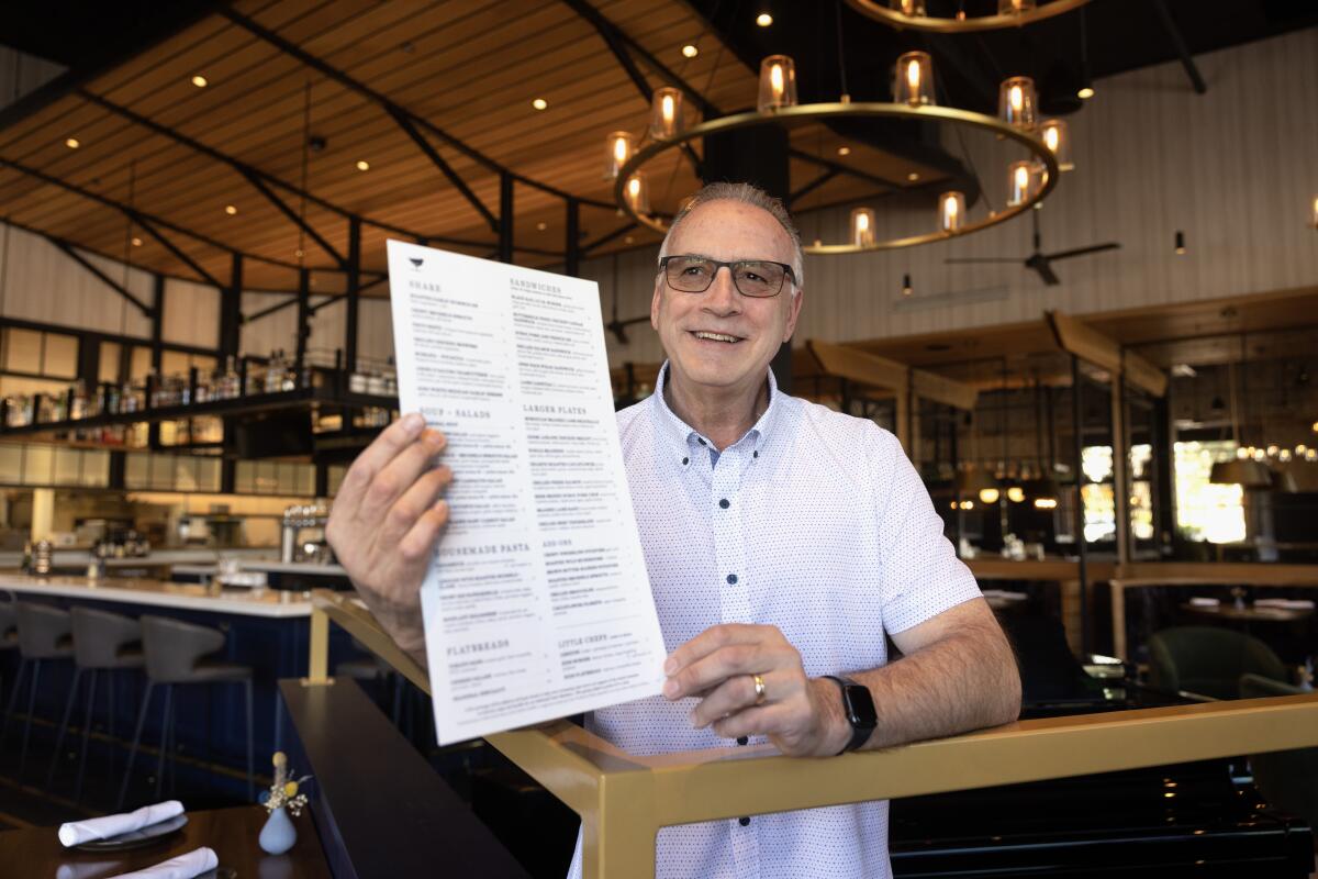 Grant Gottesman, co-owner of Black Rail Kitchen and Bar, has revised the restaurant's menu to include dishes at lower prices.