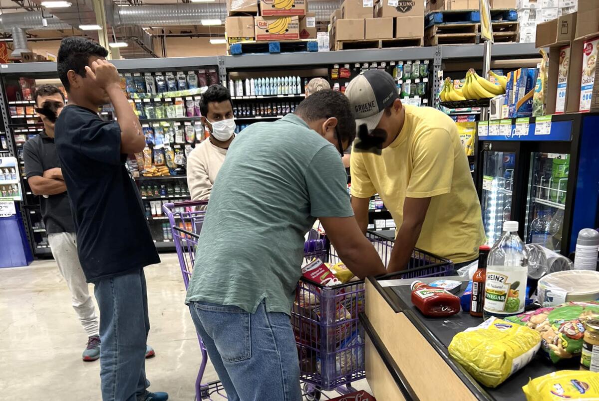 People shop for groceries