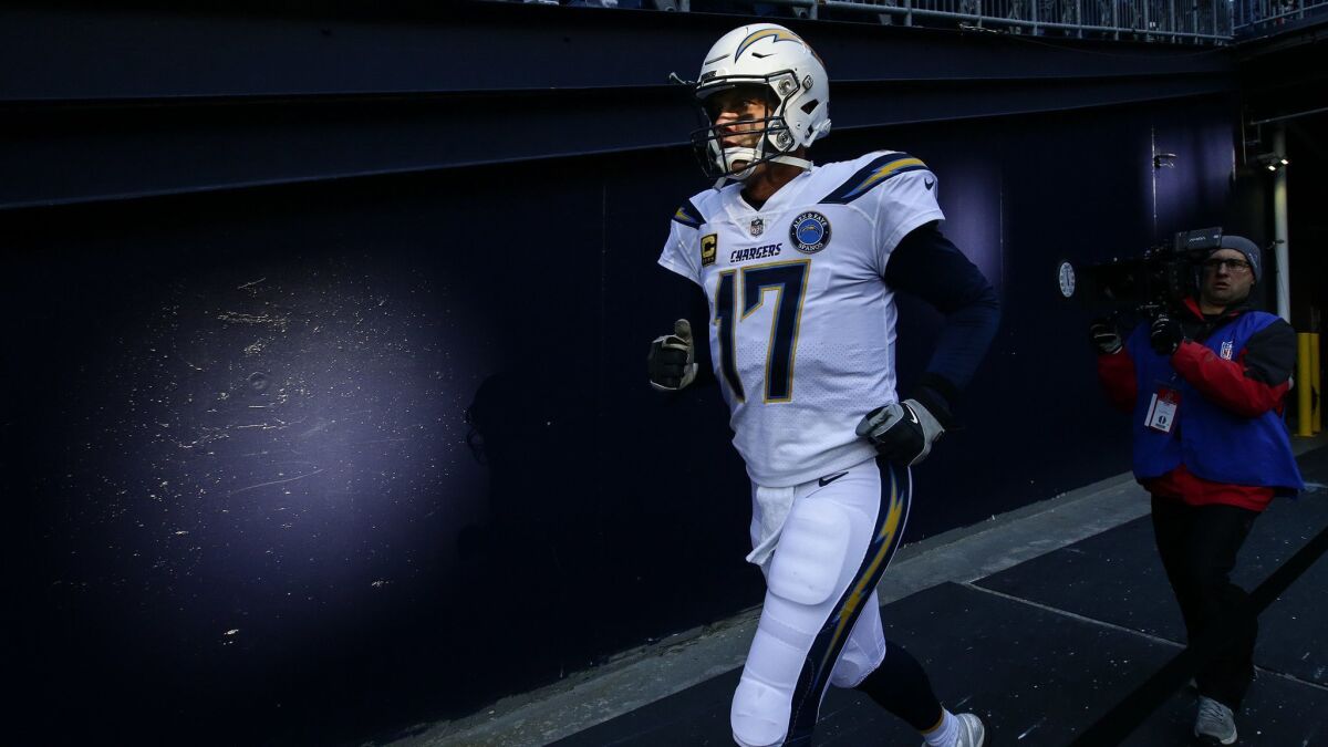 Philip Rivers takes the field to face the New England Patriots in the AFC divisional game at Gillette Stadium on Jan. 13, 2019.