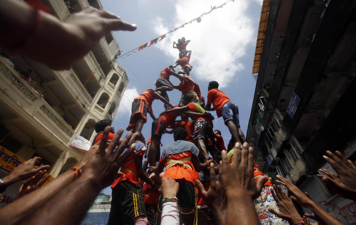 Devotees in Mumbai build a pyramid in an attempt to break an earthen pot filled with curd, an integral part of the festival of Janmashtami, last year.