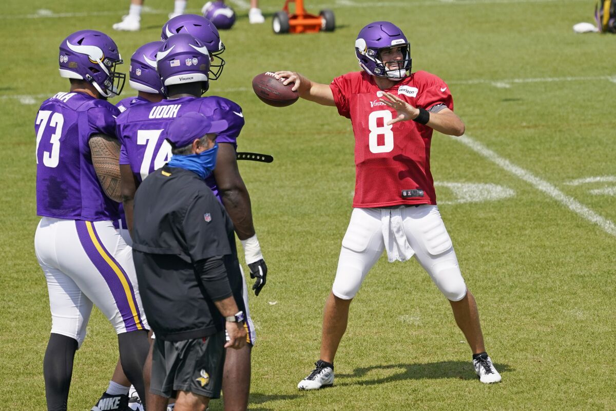 Minnesota Vikings quarterback Kirk Cousins throws in practice.