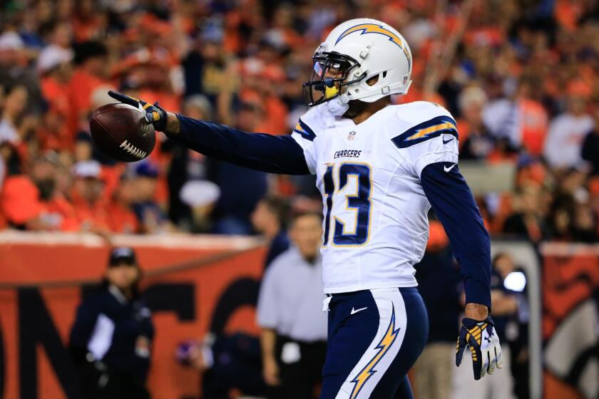 DENVER, CO - OCTOBER 23: Wide receiver Keenan Allen #13 of the San Diego Chargers celebrates after catching a 2-yard second quarter touchdown pass against the Denver Broncos during a game at Sports Authority Field at Mile High on October 23, 2014 in Denver, Colorado. (Photo by Doug Pensinger/Getty Images) ORG XMIT: 507847007