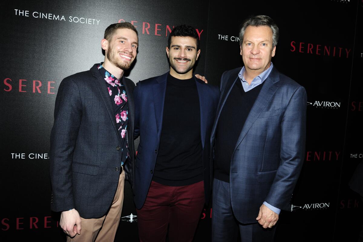 Three men on the red carpet for a film screening