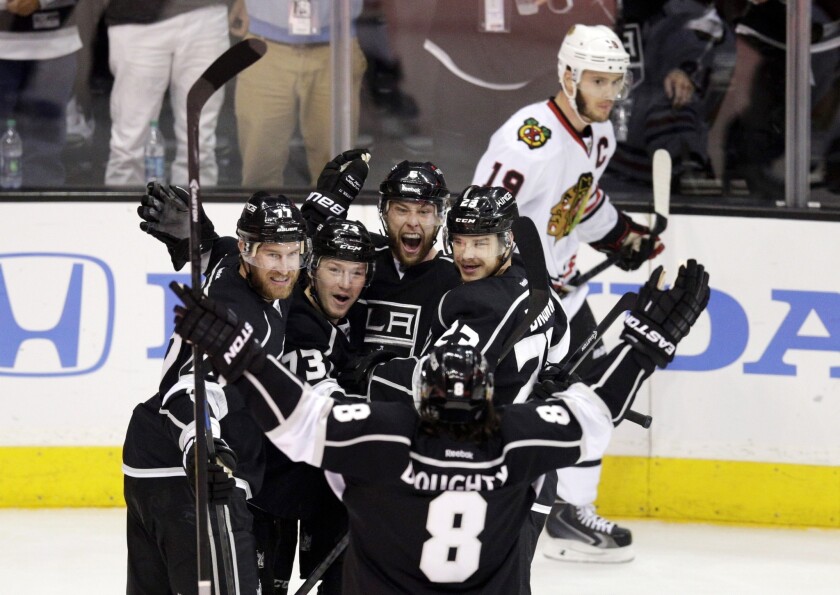 The Kings celebrate a goal by defenseman Jake Muzzin in the first period of Game 4 of the Western Conference finals against the Chicago Blackhawks at Staples Center.