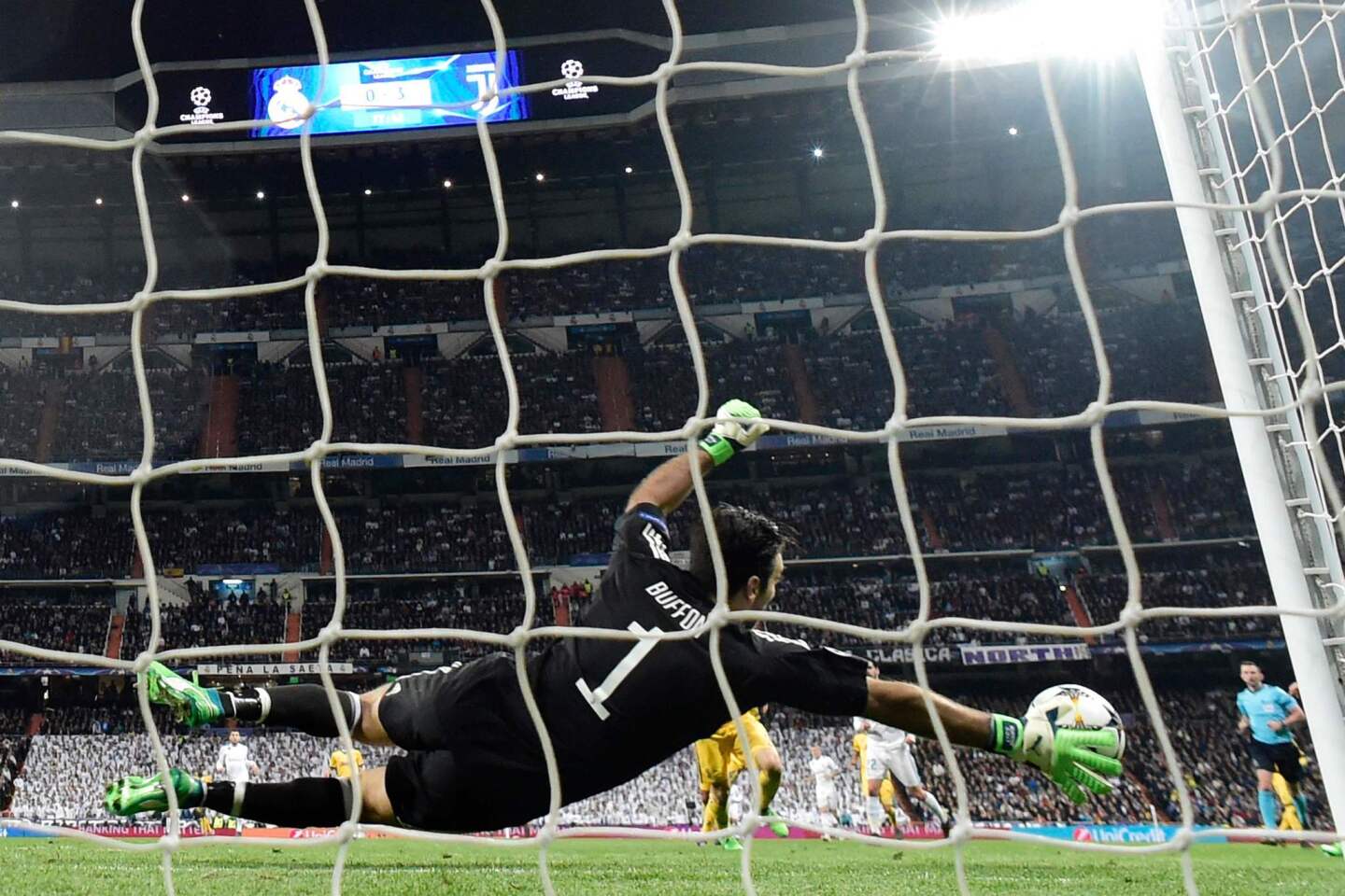 Juventus' Italian goalkeeper Gianluigi Buffon dives for the ball during the UEFA Champions League quarter-final second leg football match between Real Madrid CF and Juventus FC at the Santiago Bernabeu stadium in Madrid on April 11, 2018. / AFP PHOTO / JAVIER SORIANOJAVIER SORIANO/AFP/Getty Images ** OUTS - ELSENT, FPG, CM - OUTS * NM, PH, VA if sourced by CT, LA or MoD **