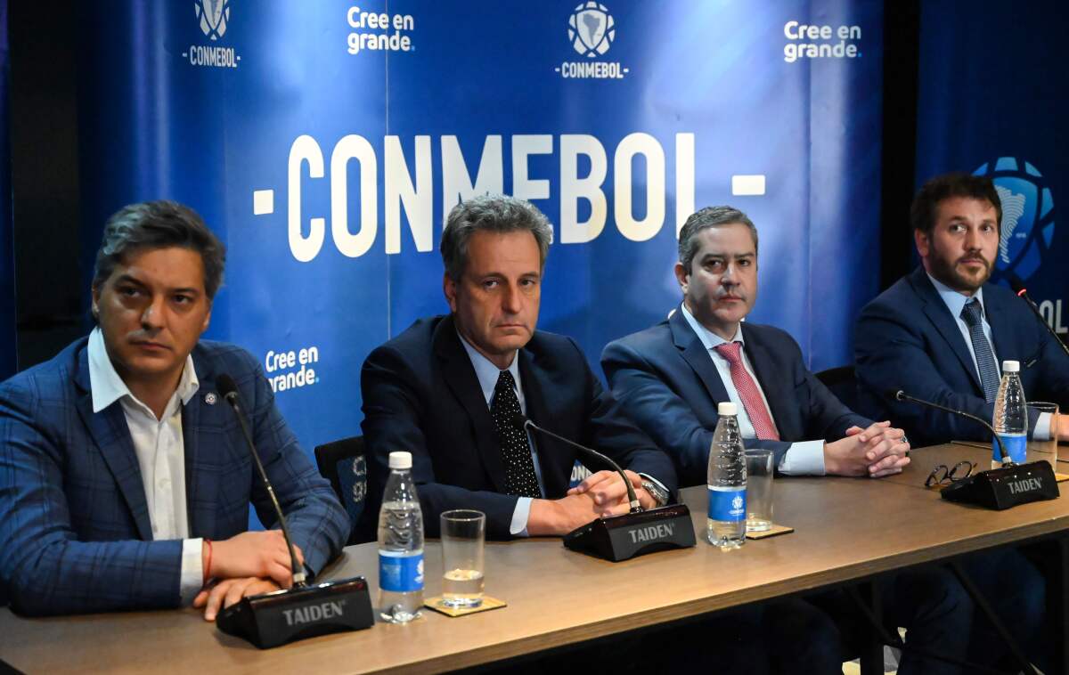 Chilean President of the ANFP Sebastian Moreno (L), Flamengo's President Rodolfo Landim (2nd L), Brazilian Football Confederation (CBF) President Rogerio Caboclo (2nd R), CONMEBOL's President Alejandro Dominguez (R) take part in a press conference announcing the location of the Libertadores Cup final next November 23 in Lima, Peru, at the headquarters of the South American Football Confederation (Conmebol), on November 5, 2019 in Luque, Paraguay. (Photo by NORBERTO DUARTE / AFP) (Photo by NORBERTO DUARTE/AFP via Getty Images) ** OUTS - ELSENT, FPG, CM - OUTS * NM, PH, VA if sourced by CT, LA or MoD **