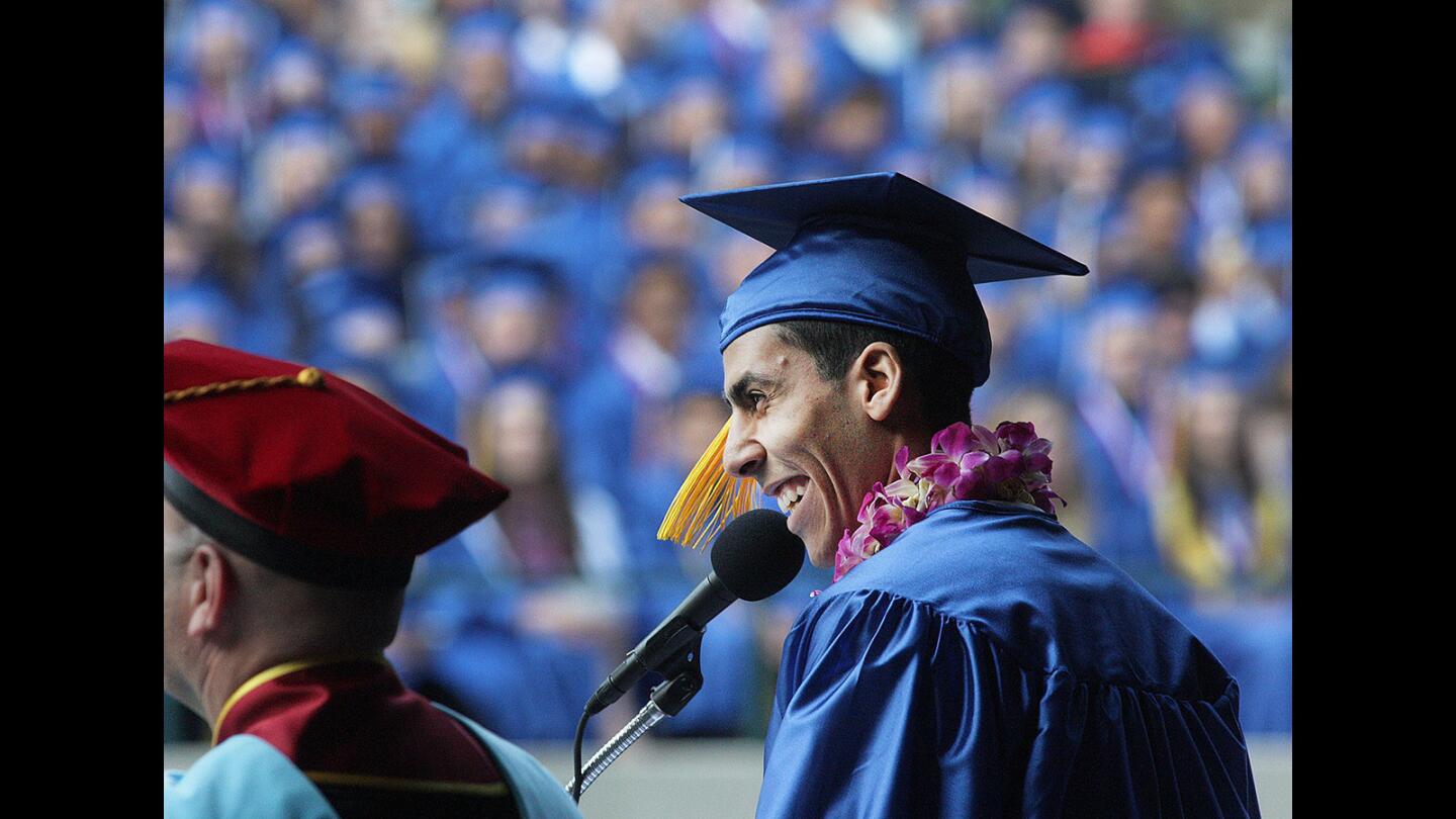 Valedictorian Daniel Ragheb smiles near the conclusion of his speech at the graduation ceremony for the 2016 class of Burbank High School at the Starlight Bowl in Burbank on Friday, May 27, 2016.