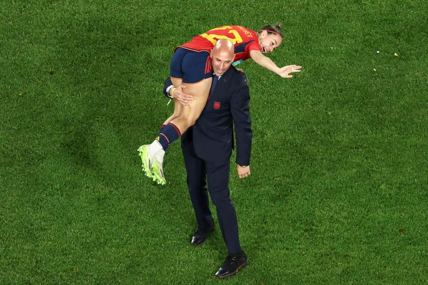 This picture taken on August 20, 2023 shows President of the Royal Spanish Football Federation Luis Rubiales carrying Spain's Athenea del Castillo Beivide on his shoulder as they celebrate winning the Australia and New Zealand 2023 Women's World Cup final football match between Spain and England at Stadium Australia in Sydney. (Photo by DAVID GRAY / AFP) (Photo by DAVID GRAY/AFP via Getty Images)