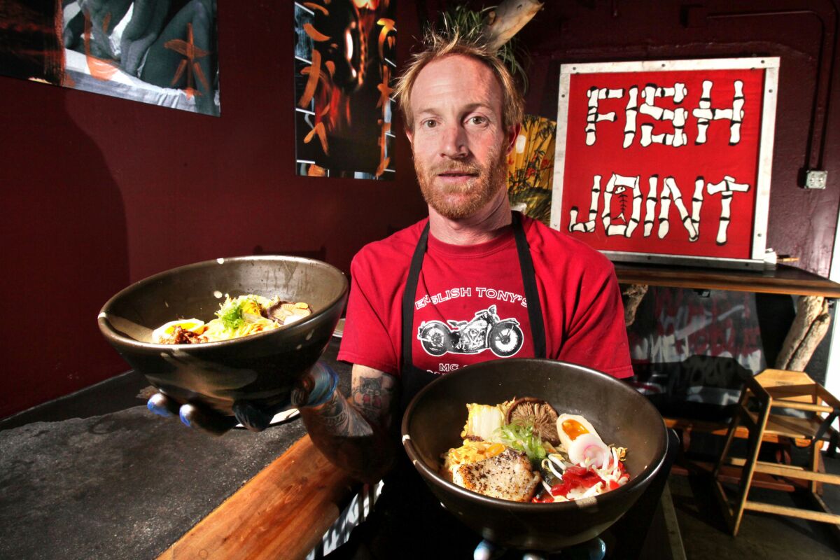 Chef Davin Waite, owner of The Whet Noodle, holds two of his ramen noodle creations.