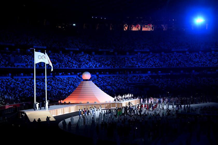 Entertainers perform during opening ceremonies at the 2020 Tokyo Olympics. 