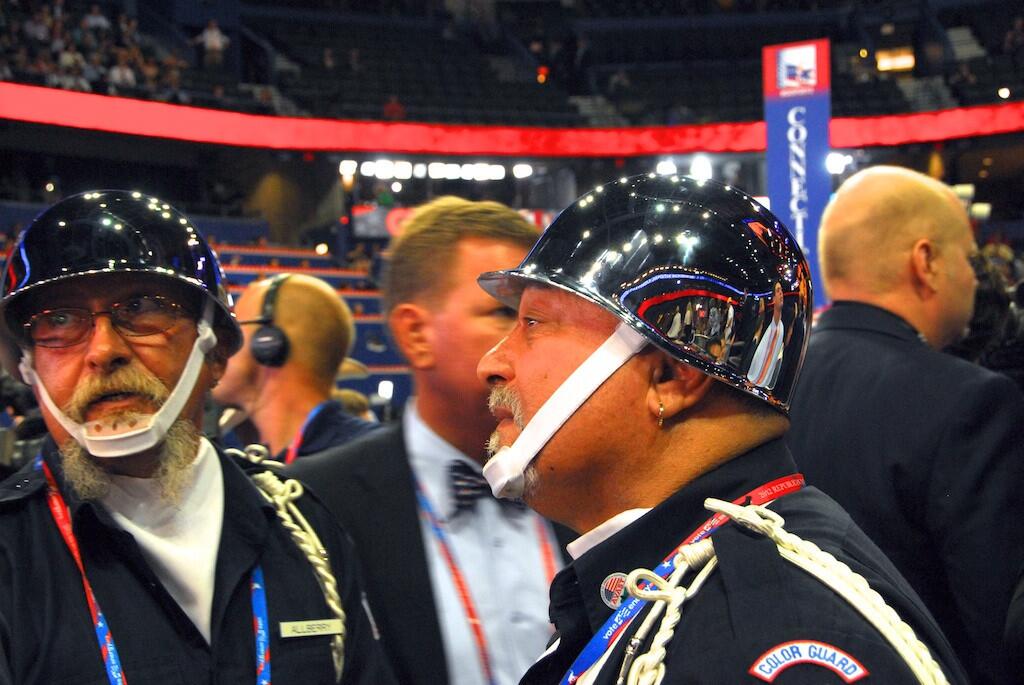 Steven Allberry, left, and Bob Fleischmann, both of Tampa, shows off his headgear as part of the Amputee Veterans of America Support Team at the RNC on Aug. 29, 2012.