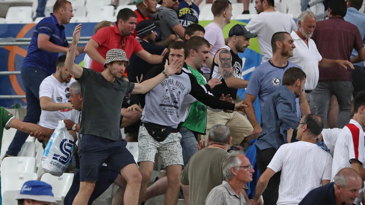 Russian supporters charge at England fans at the end of a Euro 2016 soccer match between England and Russia at the Velodrome in Marseille, France, on June 11.