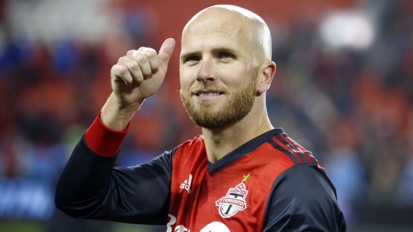 Toronto FC midfielder Michael Bradley gives a thumbs-up to the crowd following a victory over Atlanta United on Oct. 28, 2018.