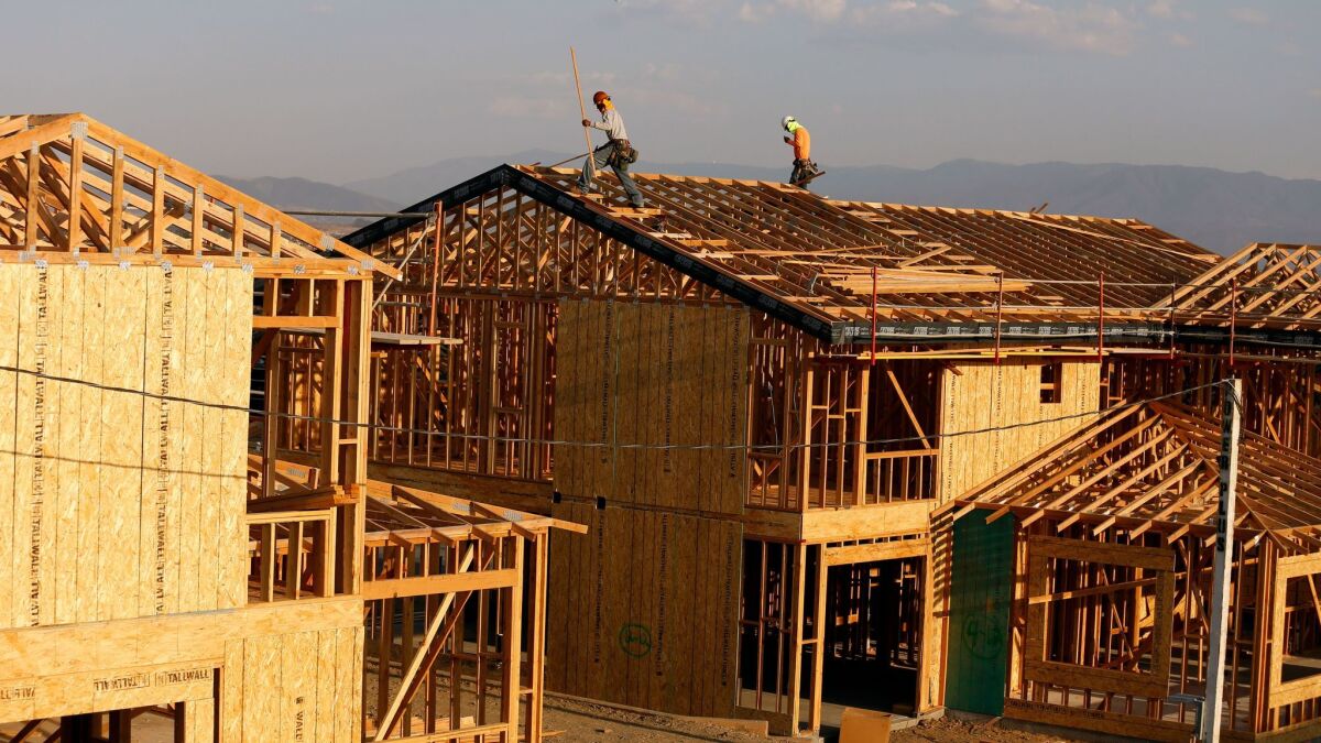 Crews work on new homes under construction in Murrieta. Home prices in the six-county region climbed 7.5% in August from a year earlier.