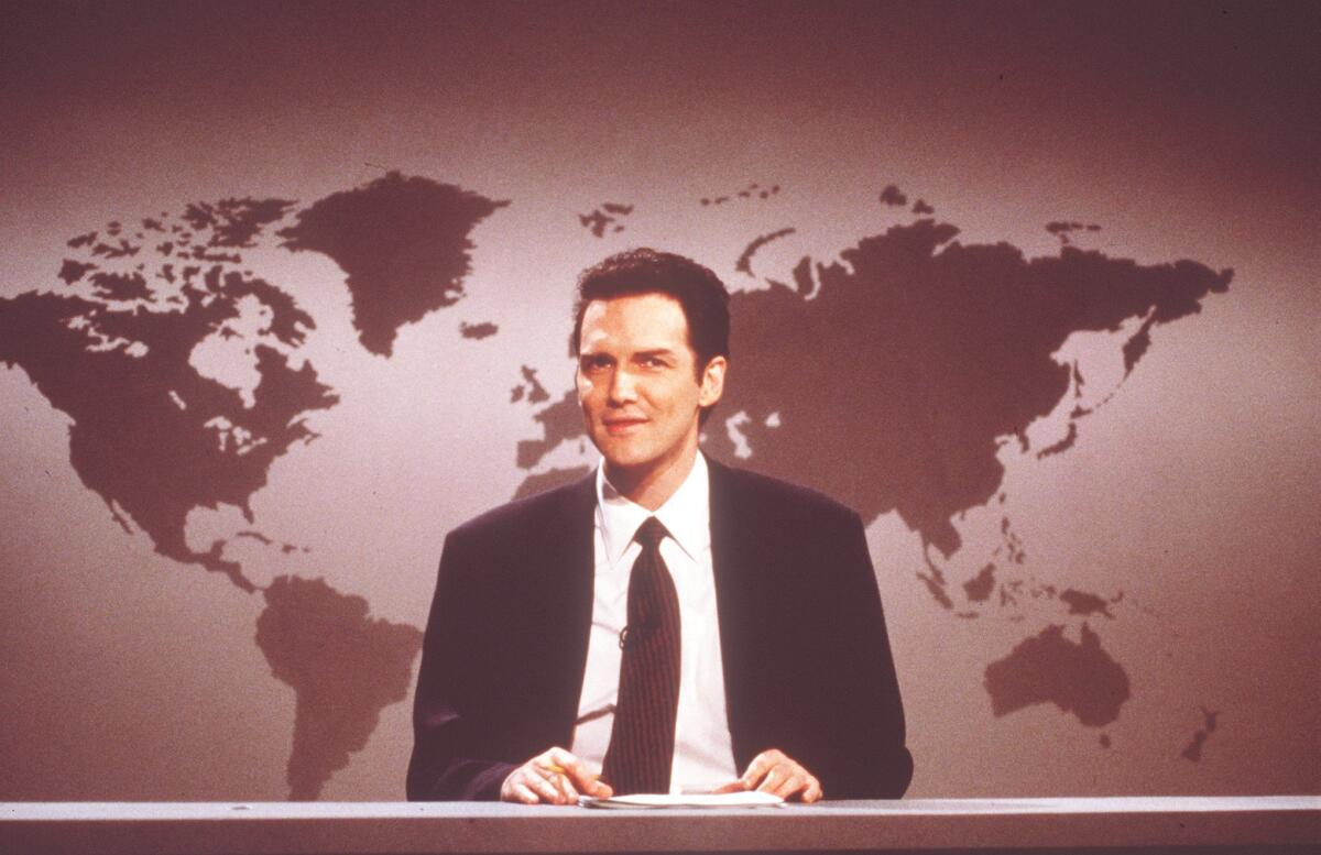Norm Macdonald anchoring "Weekend Update" during an airing of Saturday Night Live.