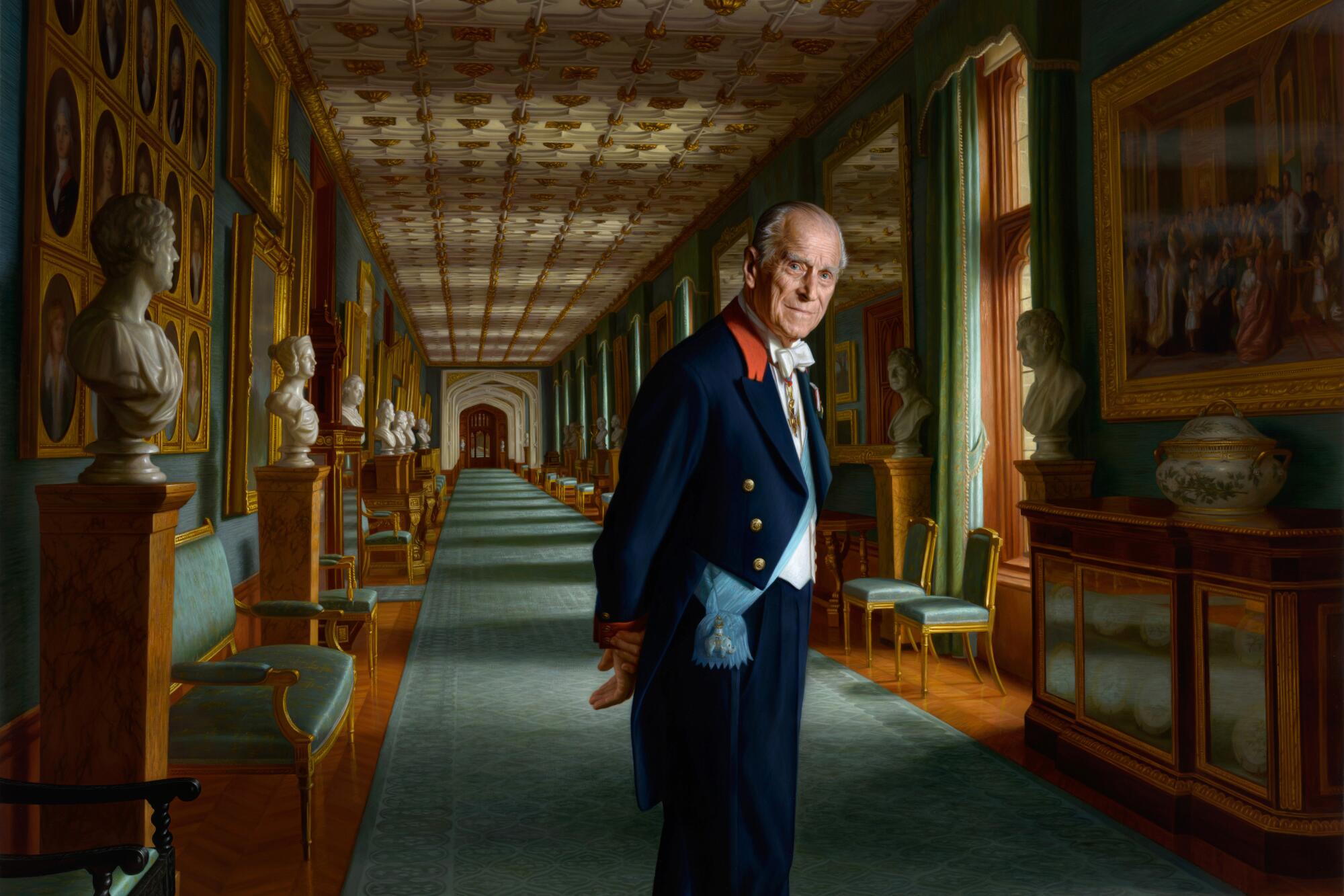 A painting of Prince Philip shows him in a royal sash with hands behind his back.