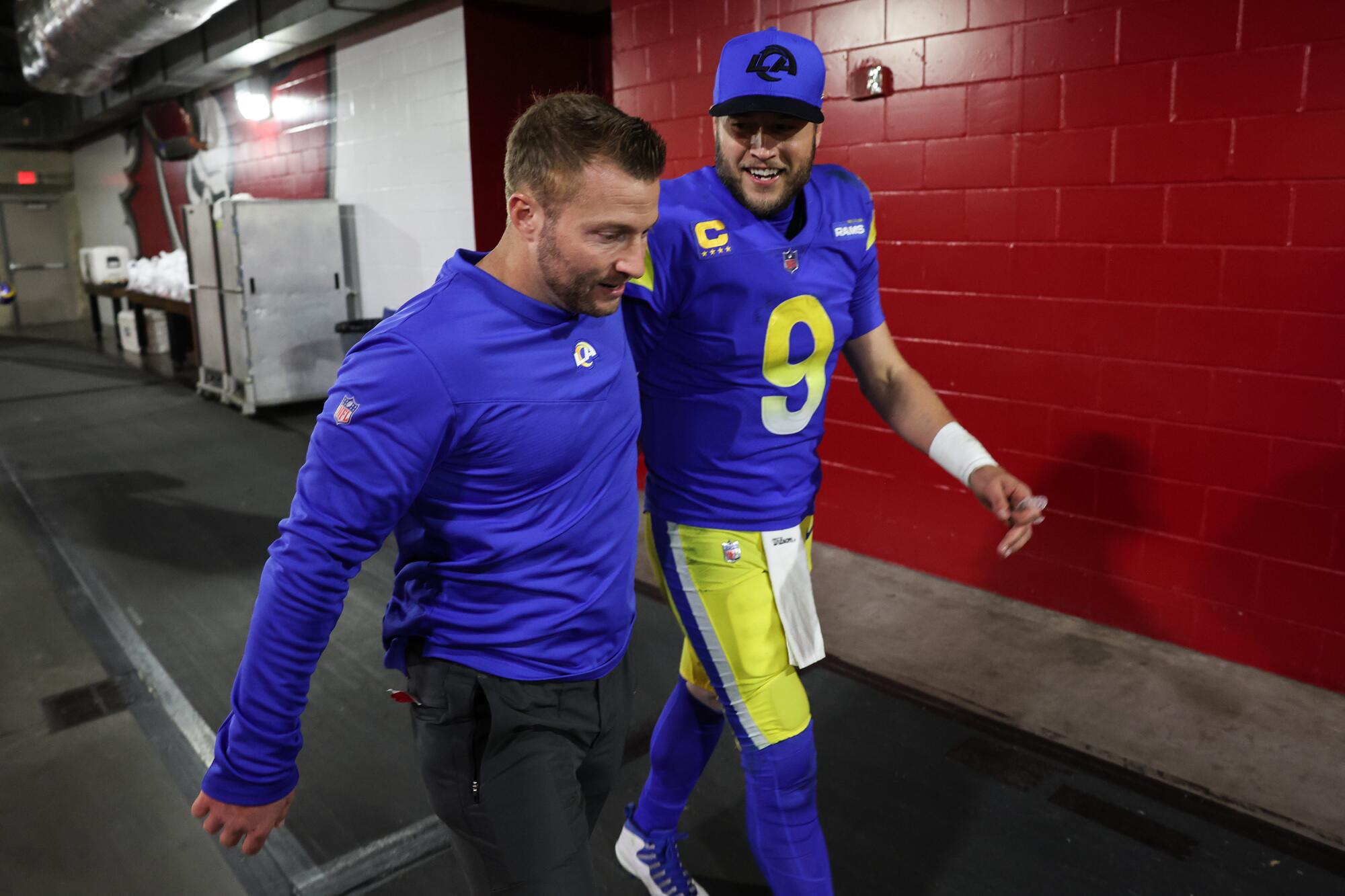 Rams coach Sean McVay and quarterback Matthew Stafford head to the locker room.