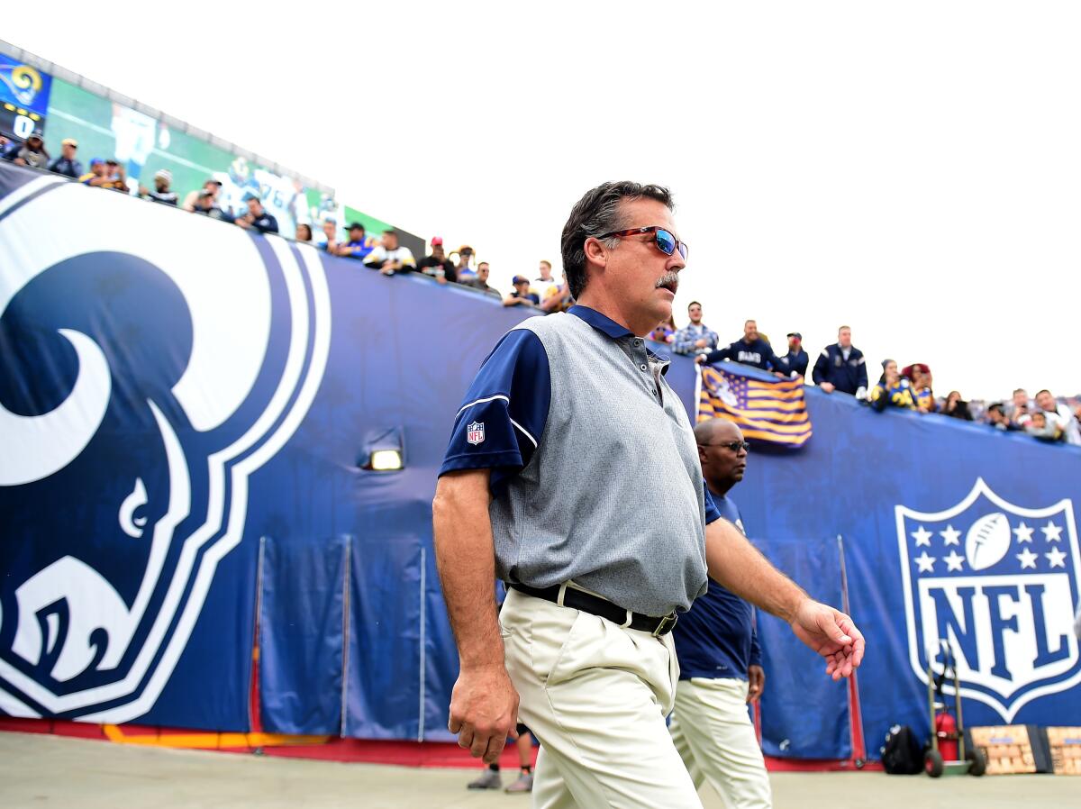 Rams coach Jeff Fisher  takes to the field before the game against the Atlanta Falcons in 2016 at the Coliseum.
