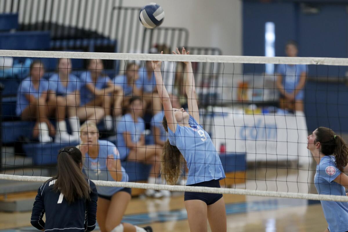 Corona del Mar's Bella Pouliot (9) sets the ball backward against Trabuco Hills during the first set of a nonleague match on Thursday.