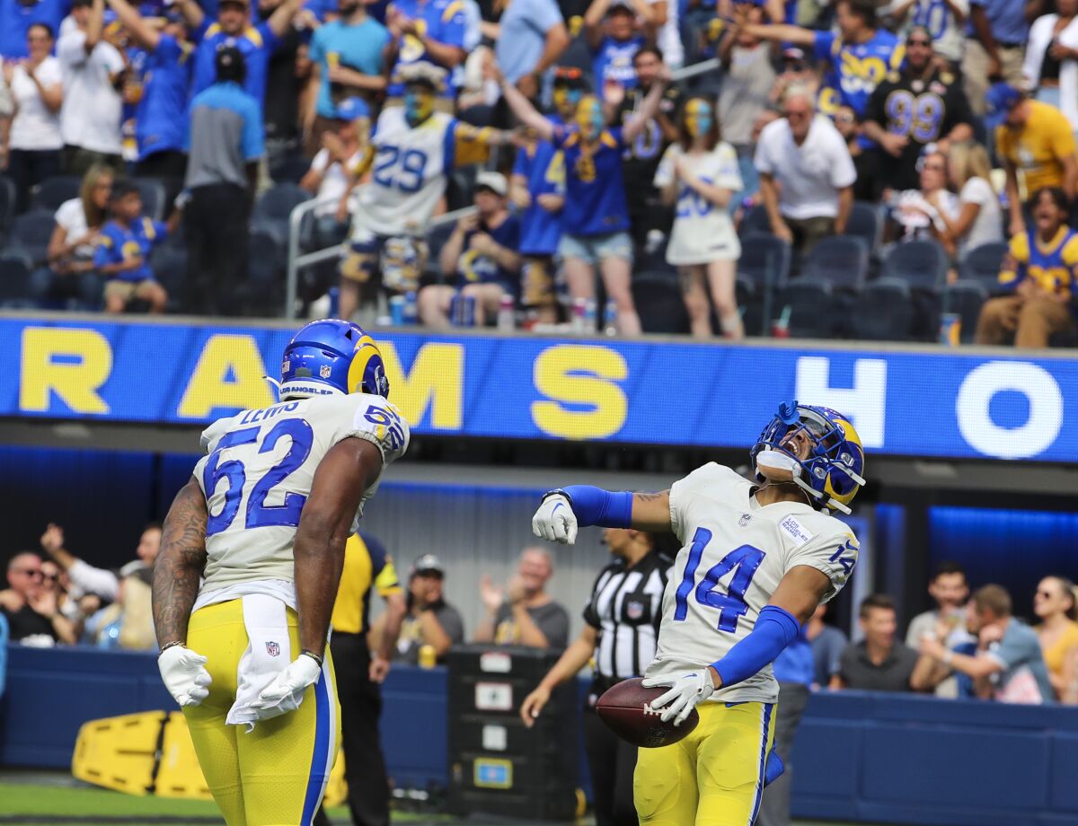 Rams defensive back Cobie Durant, right, celebrates with linebacker Terrell Lewis.