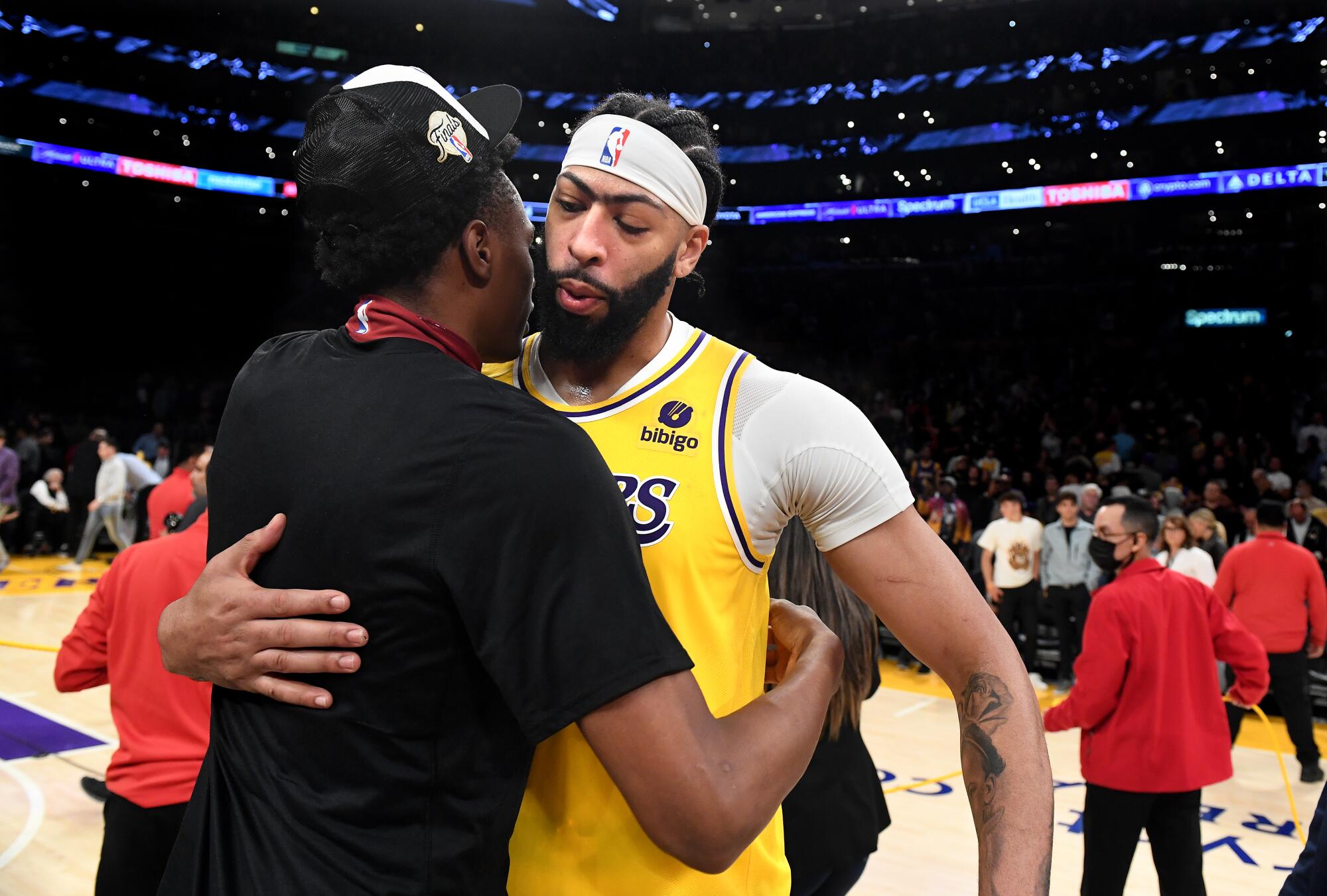 Lakers forward Anthony Davis gets a hug after being swept by the Denver Nuggets.