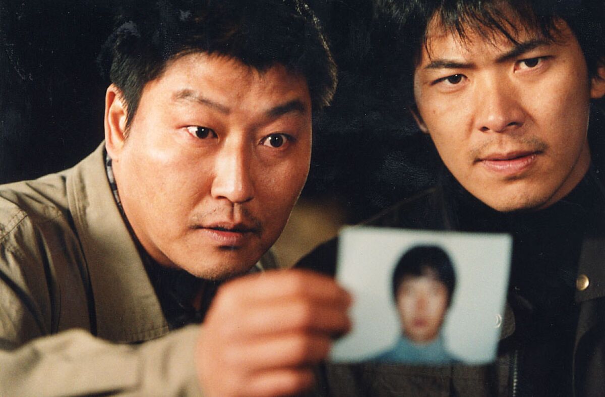 Song Kang Ho, left, and Kim Sang-kyung in "Salinui Chueok" (Memories Of Murder).