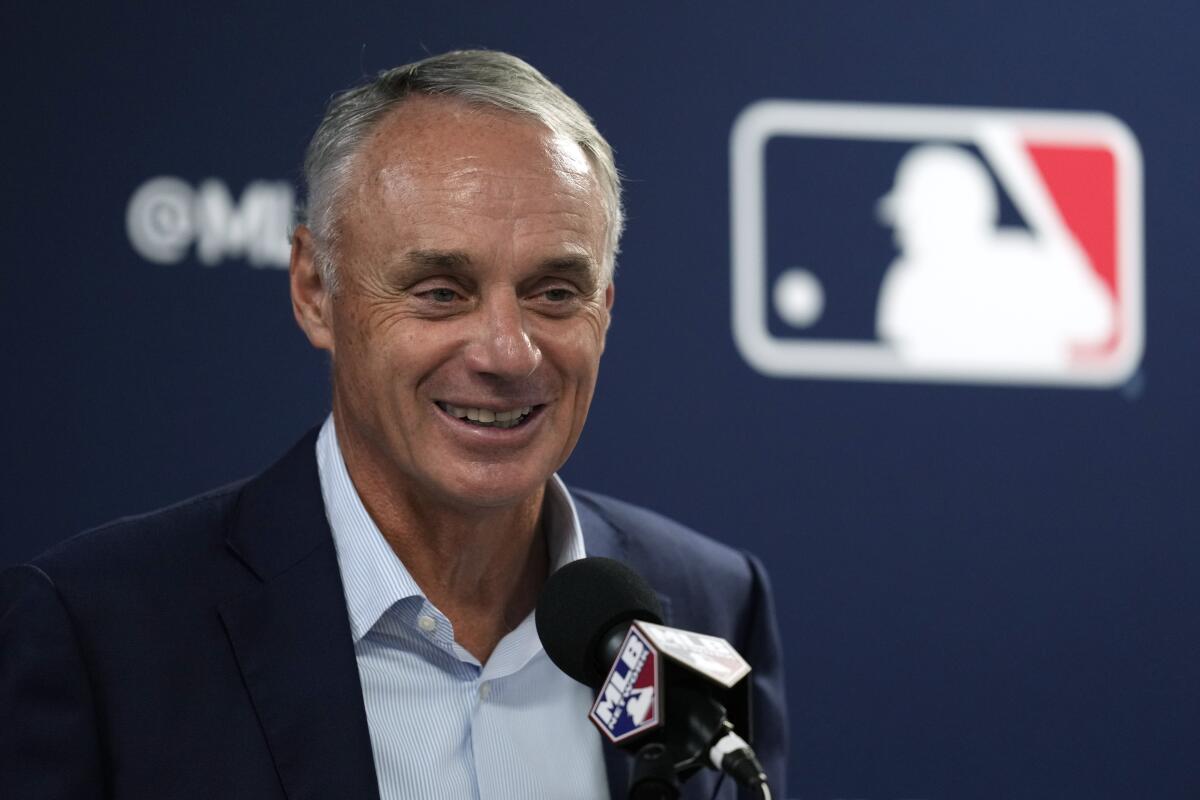 MLB commissioner Rob Manfred holds a news conference during spring training.