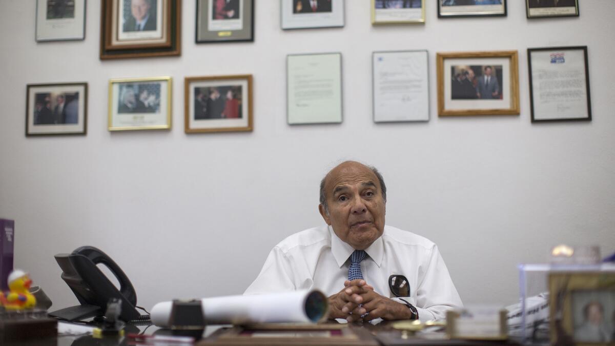 South Gate Mayor Henry Gonzalez sits in his City Hall office. His negotiating skills for the UAW earned him the nickname "Hammerin' Hank."