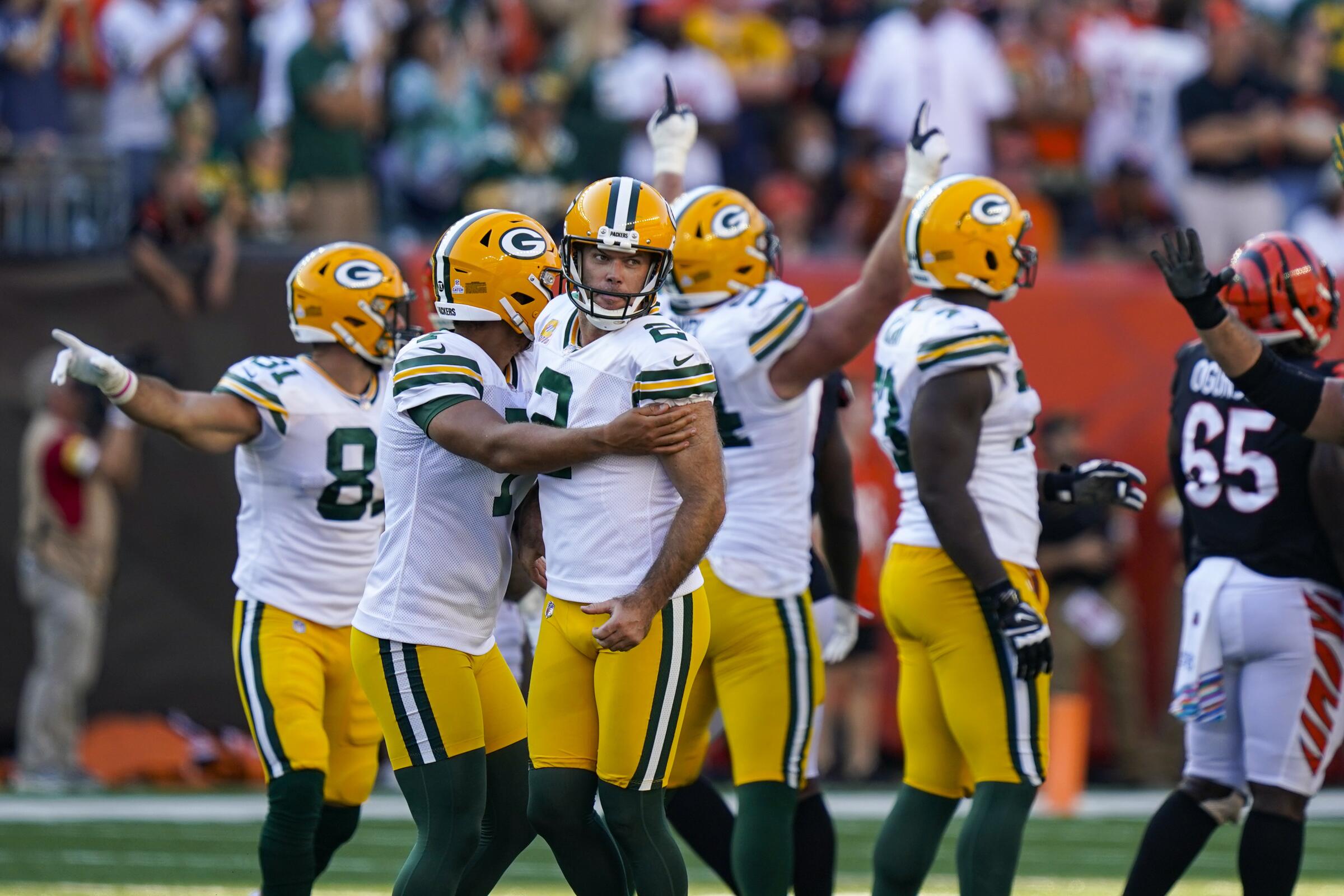 Green Bay Packers kicker Mason Crosby celebrates with teammates after making a 49-yard field goal.