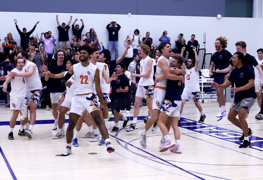 Orange Coast College celebrates after winning the 2022 California Community College Athletic Assn. state championship.  