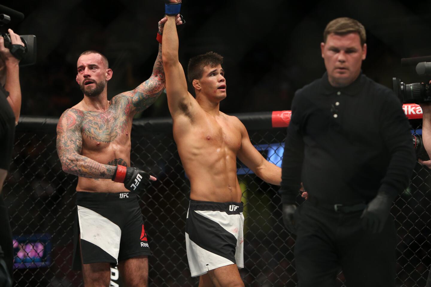 CM Punk, left, lost by submission to Mickey Gall on Sept. 10 at UFC 203 in Cleveland.