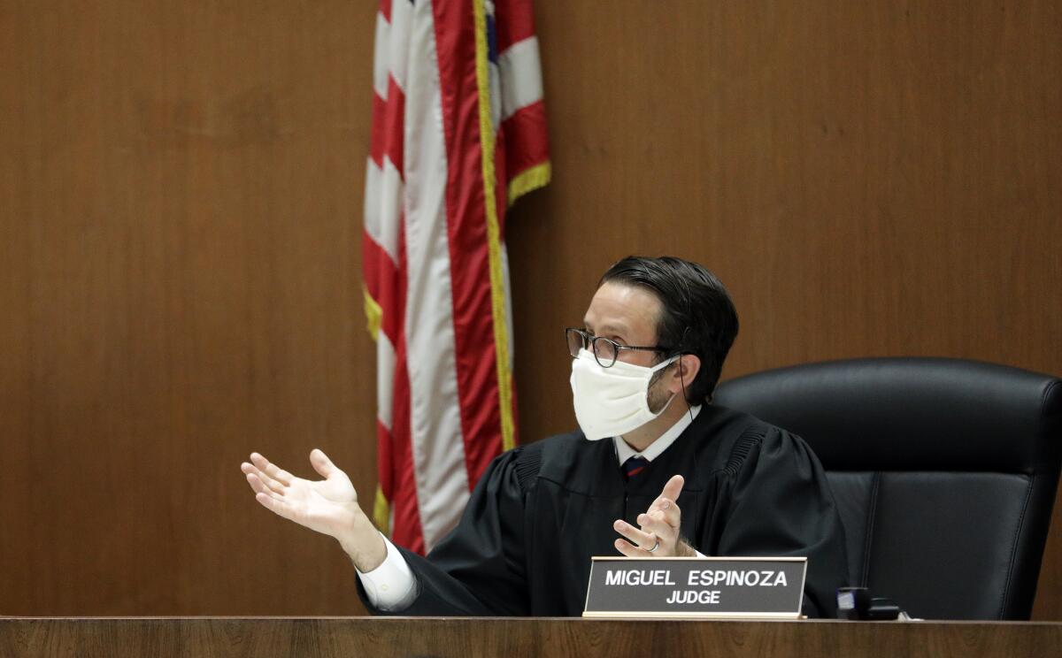 Los Angeles Superior Court Judge Miguel Espinoza holds arraignments in his courtroom via video at Clara Shortridge Foltz Criminal Justice Center on April 21 in Los Angeles.