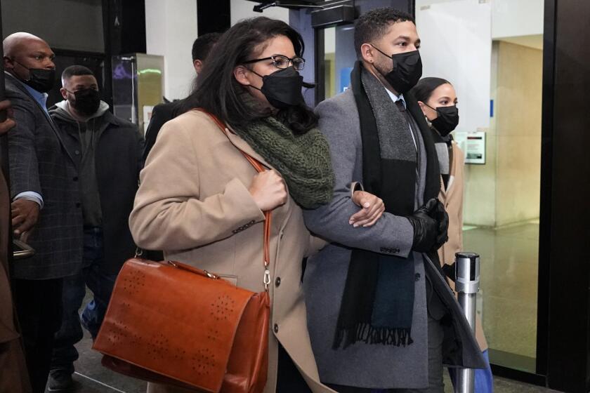 Actor Jussie Smollett leaves the Leighton Criminal Courthouse with his siblings Dec. 9.
