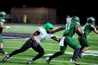 Mark Iheanachor of Narbonne (0) makes tackle against Pacifica.