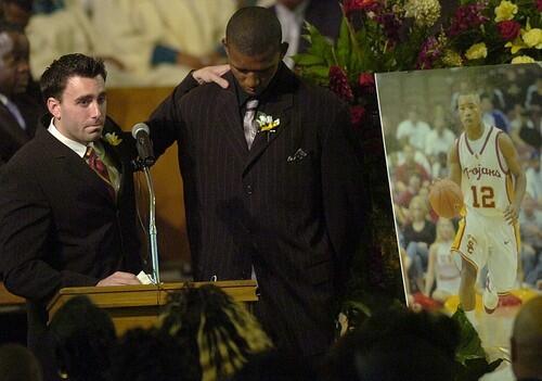 University of Southern California basketball players Chris Penrose, left, and Nick Young speak at the funeral of teammate Ryan Francis
