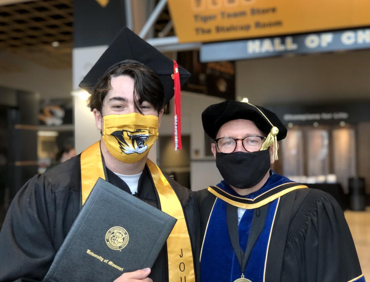 Mary McNamara's son Danny Stayton, poses for a photo with his professor, Stacey Woelfel