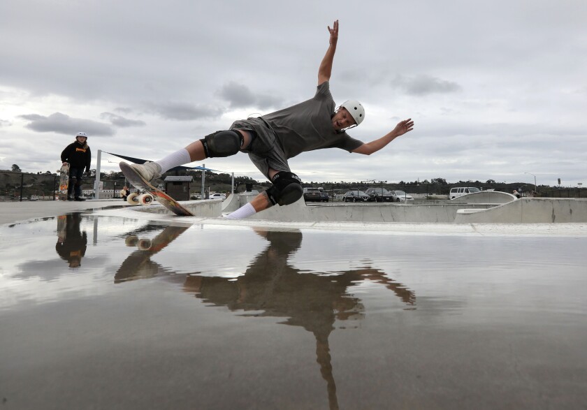 As the sky clouds up skateboarder Fred Kaehler, 38, of Vista, skates near a puddle at the Prince Memorial Skatepark