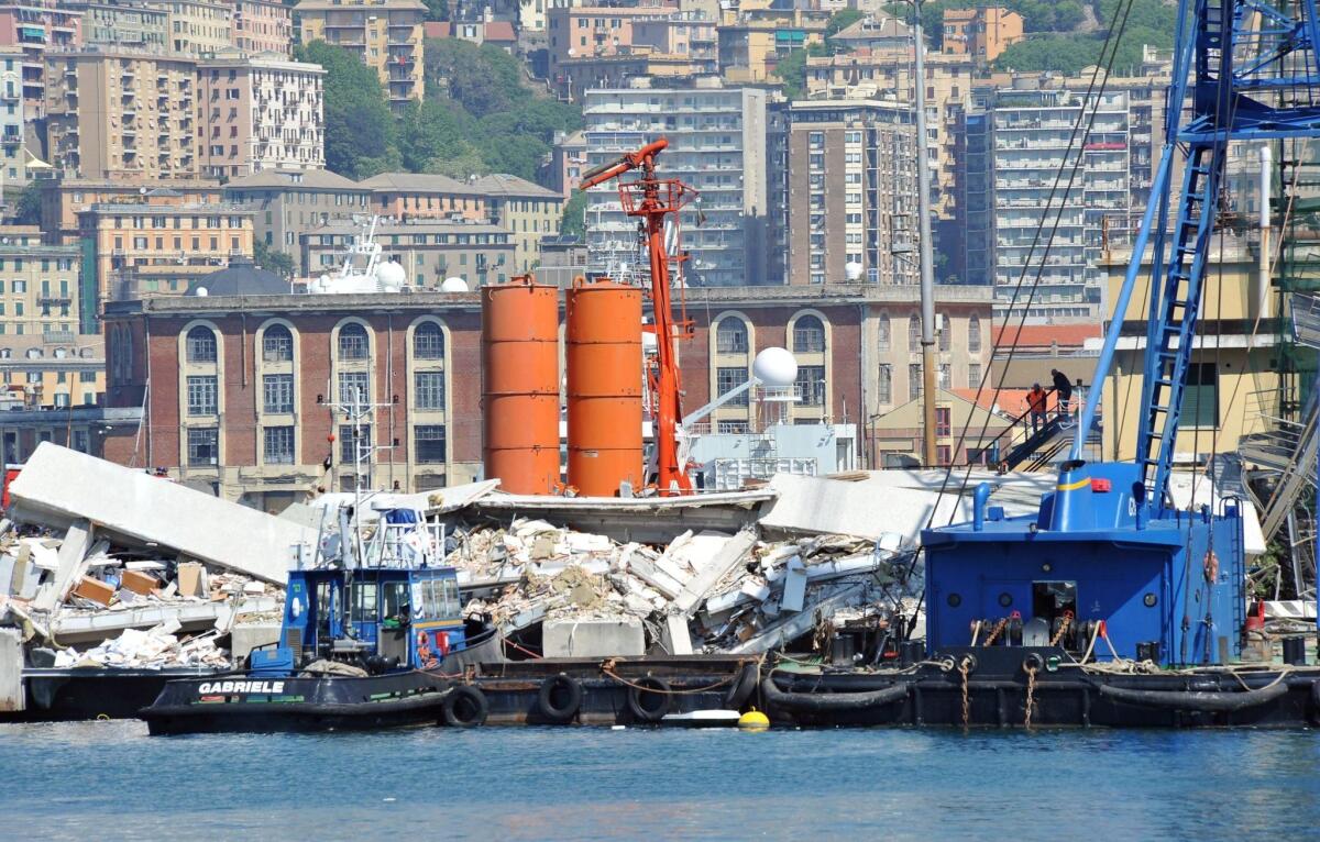 Wreckage is strewn about after the container ship Jolly Nero slammed into an observation tower at the port of Genoa, Italy.